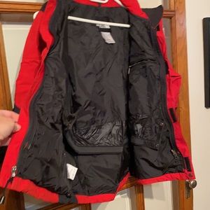 Youth L North face parka. With hood and lots of pockets.